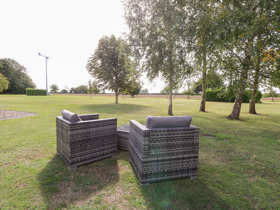 Chairs and table in a garden at The Annexe Litcham