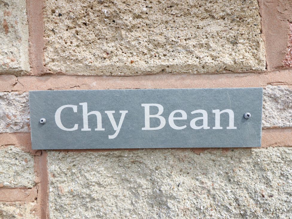 A plaque with the name Chy Bean on a stone wall in Abergele