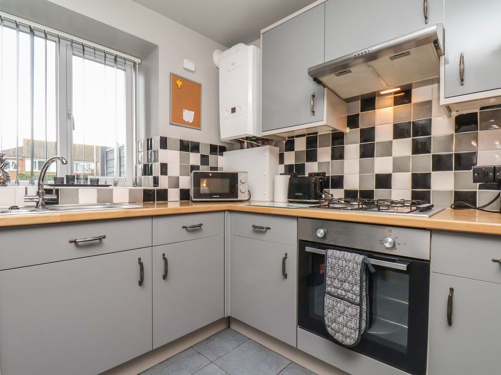 A kitchen with a sink and oven at Fortunatus in Whitby