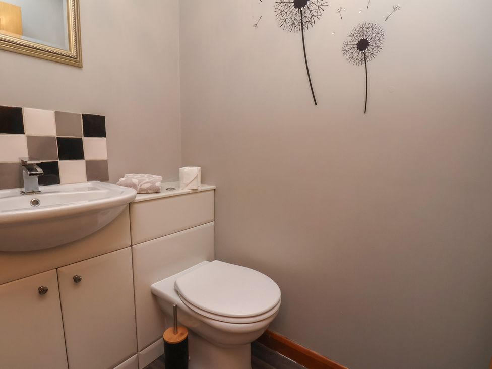 A bathroom with a sink and toilet at Fortunatus in Whitby