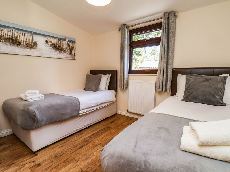 A bedroom with two beds at Snowdrop in Saltburn-by-the-Sea