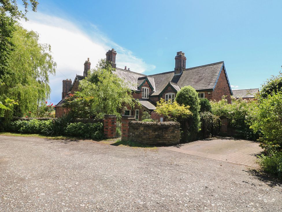 A house with a driveway and garden at Just A Cottage, Newlands Farm, Golden Valley near Riddings and Alfreton