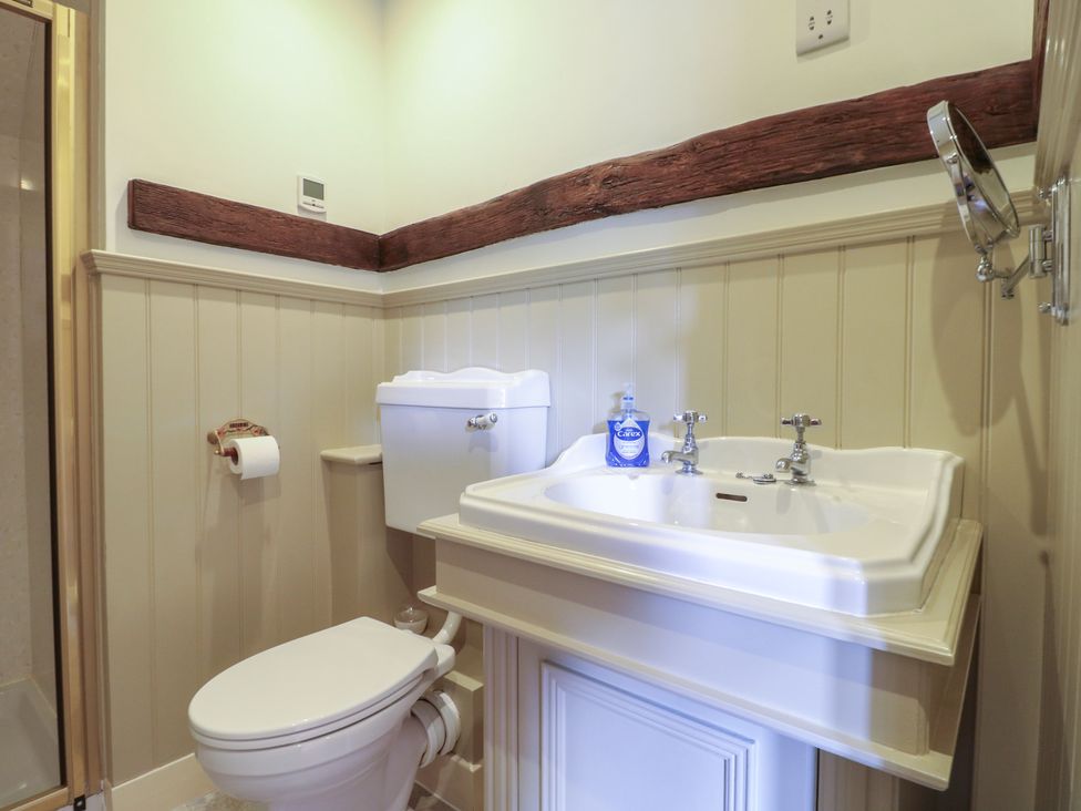 A bathroom with a sink and toilet at Just A Cottage, Newlands Farm, Golden Valley near Riddings and Alfreton