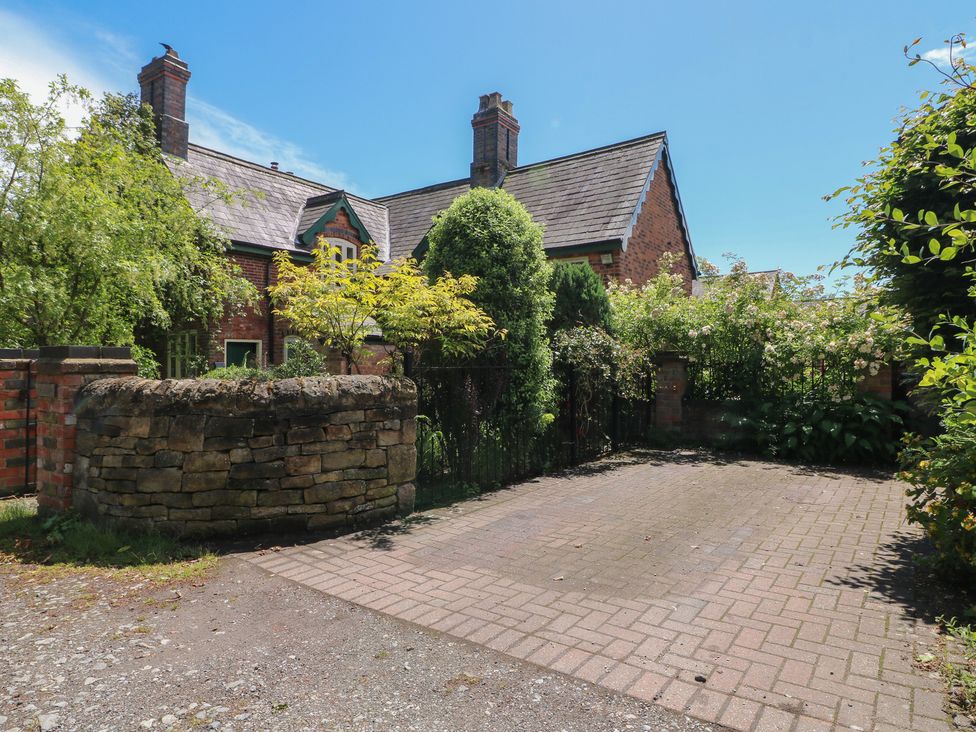 A house with a paved area and garden at Just A Cottage, Newlands Farm in Golden Valley near Riddings and Alfreton