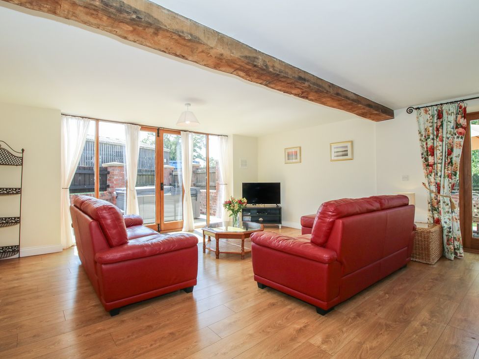 A living room with sofas and a coffee table at The Wainhouse in Bockleton near Tenbury Wells