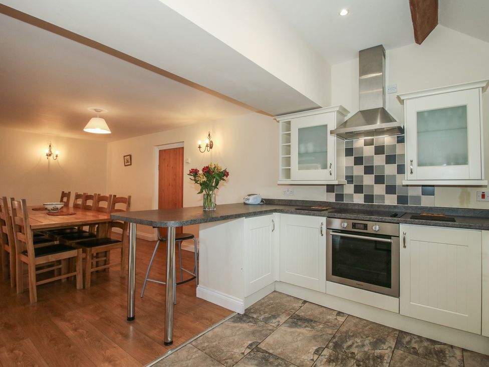 A kitchen with dining area and appliances at The Wainhouse in Bockleton near Tenbury Wells