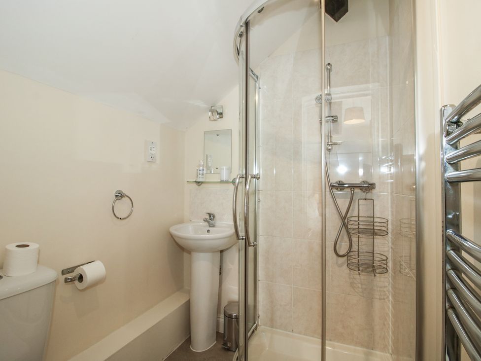A bathroom with a shower and a washbasin at The Wainhouse in Bockleton near Tenbury Wells