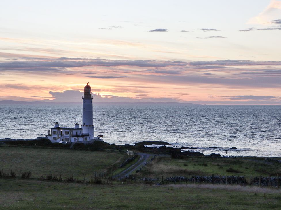 A lighthouse by the sea at Corsewall Castle Farm Lodges in Kirkcolm