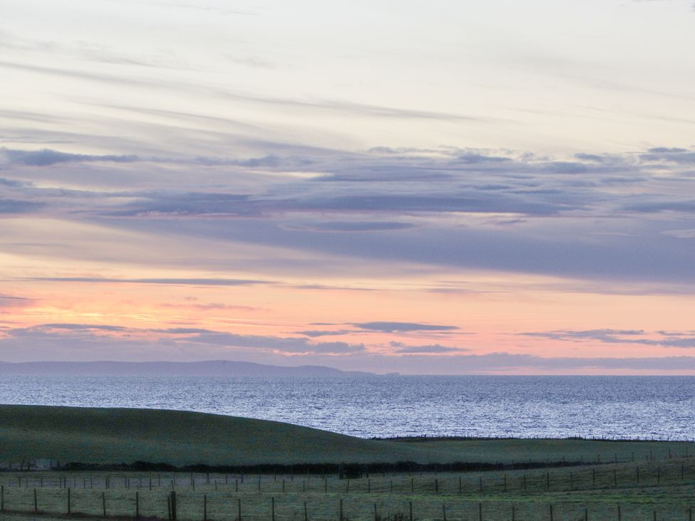 A view of the ocean and hills at Corsewall Castle Farm Lodges in Kirkcolm