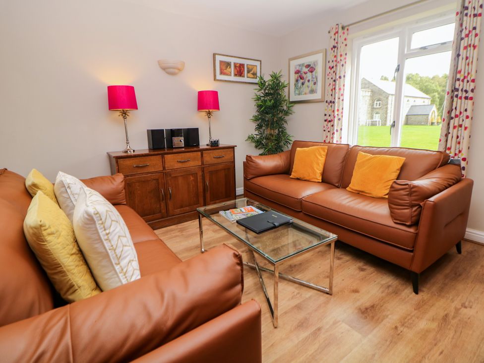 A living room with sofas and a coffee table at Wensley in Matlock