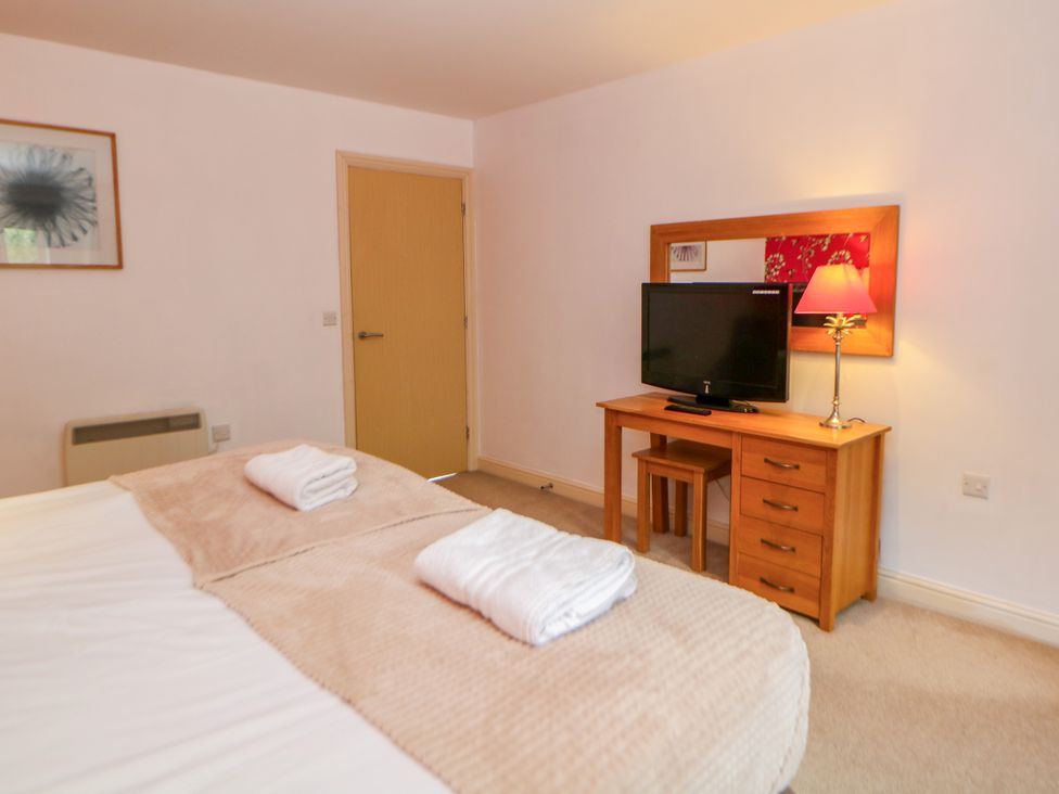 A bedroom with a bed and television at Wensley in Matlock