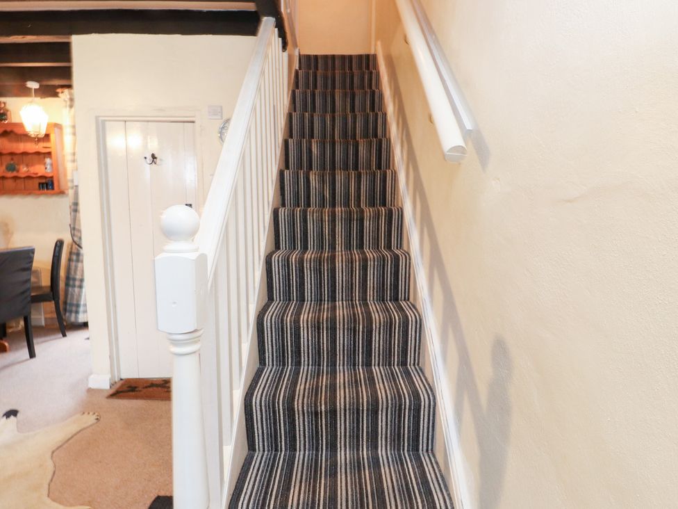 A staircase leading to the upper floor at Merlin in Llithfaen near Nefyn