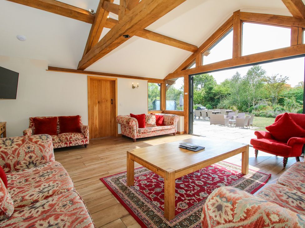 A living room with sofas and a coffee table at The Old Farmhouse in Westhope