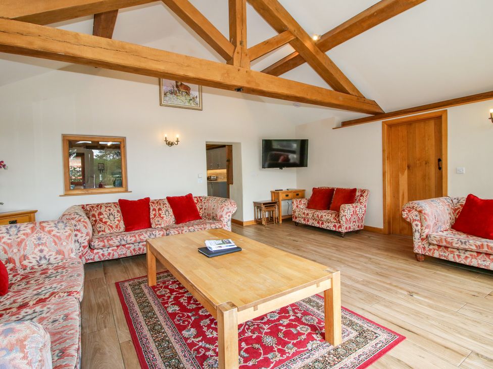 A living room with sofas and a coffee table at The Old Farmhouse in Westhope