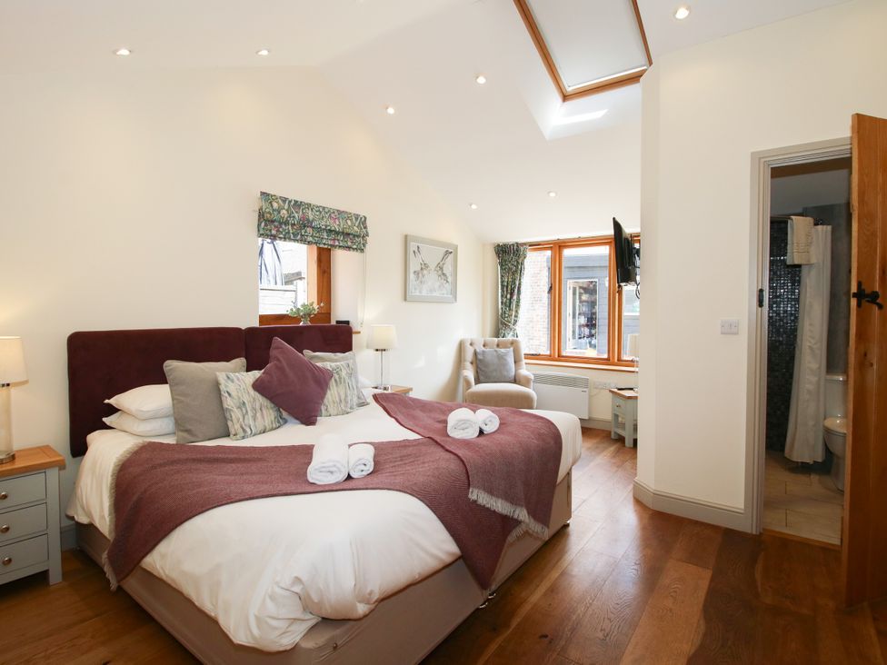 A bedroom with a bed and window at The Old Farmhouse in Westhope