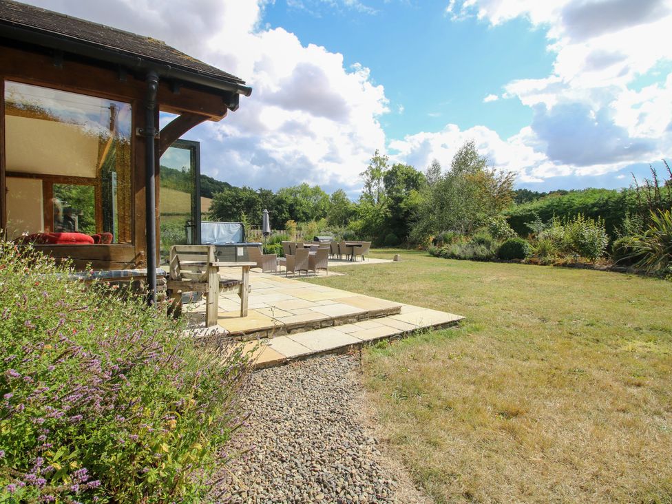 A house with garden furniture and patio at The Old Farmhouse in Westhope