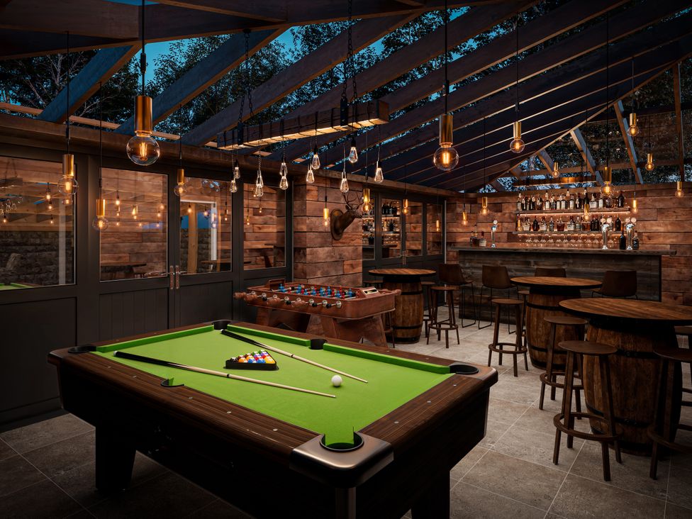 A game room with a pool table and bar at Poacher's Arms in Hope