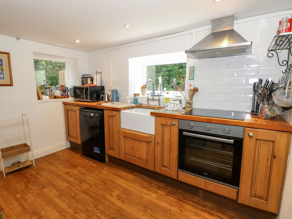 A kitchen with a sink and appliances at Sweet Briars in Chale