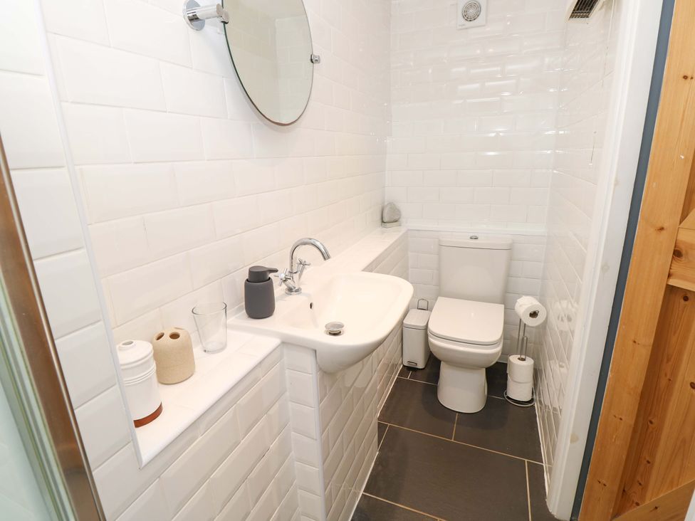 A bathroom with a sink and toilet at Sweet Briars in Chale