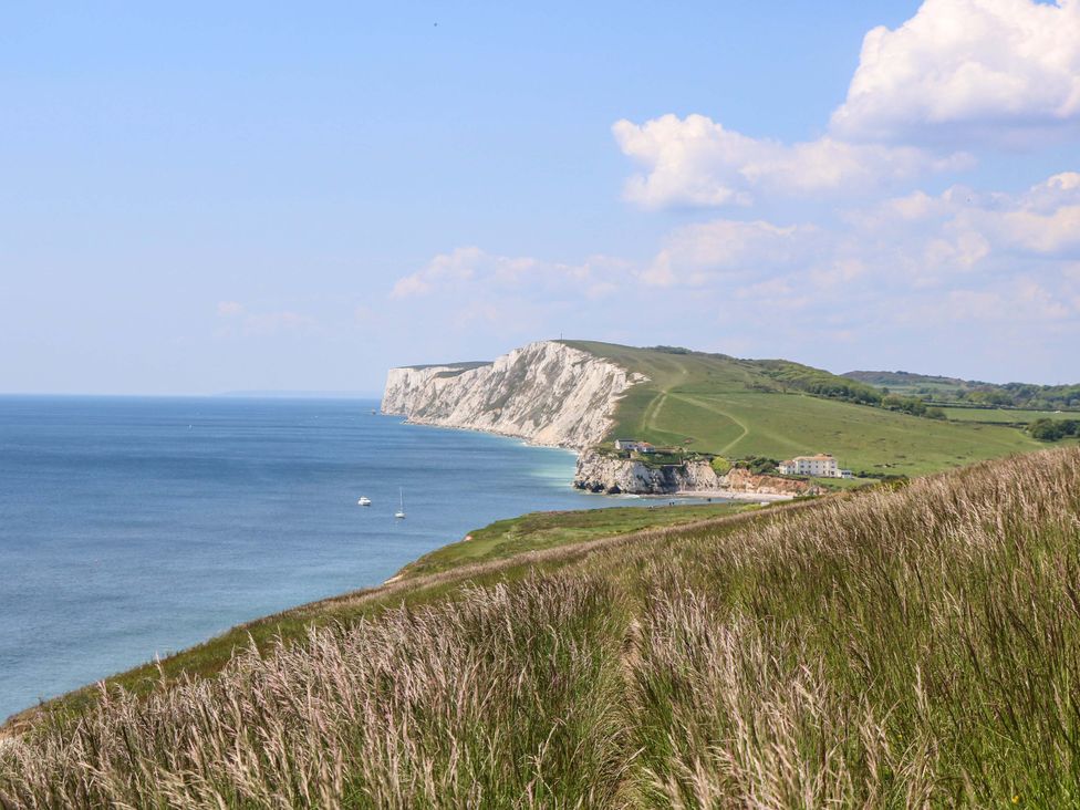 A coastal view of cliffs meeting the ocean at Sweet Briars in Chale
