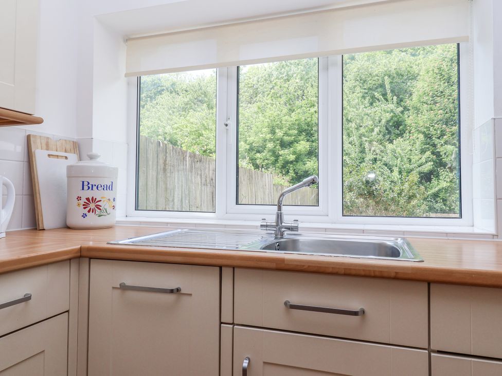 A kitchen with a sink and bread bin at The Wagon Shed in Gransmoor near Bridlington
