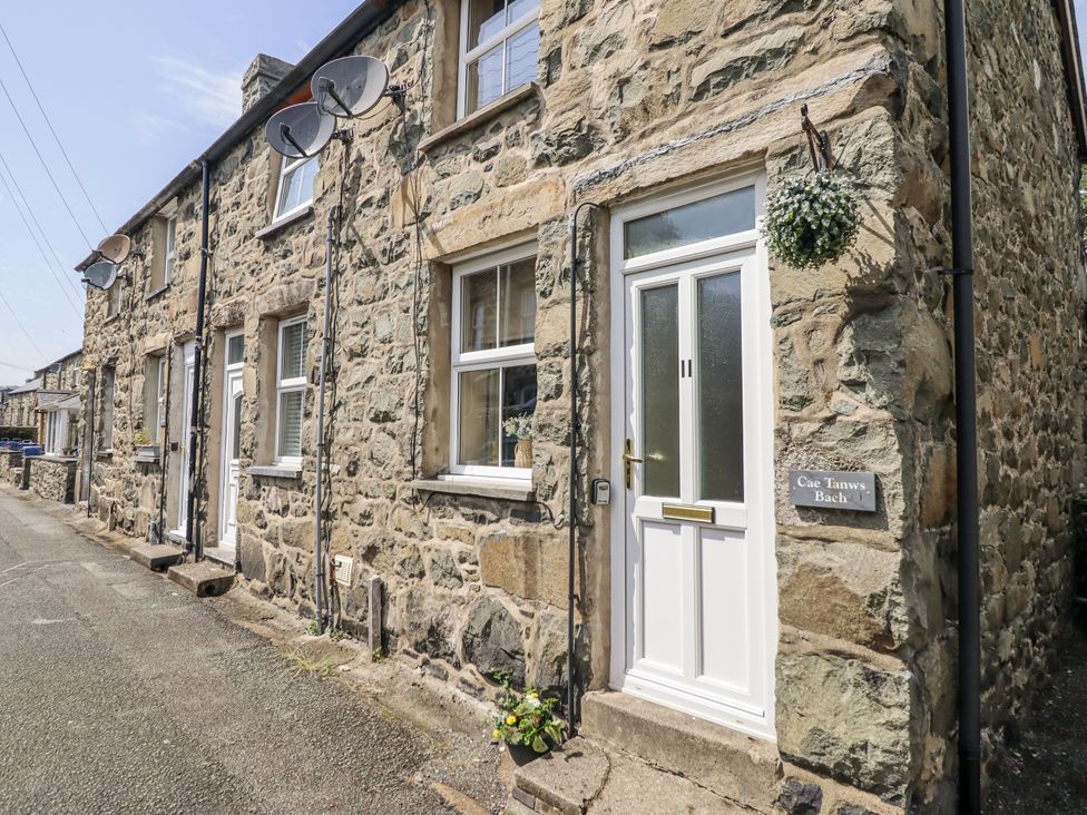 A stone exterior with a front door at Cae Tanws Bach in Dolgellau
