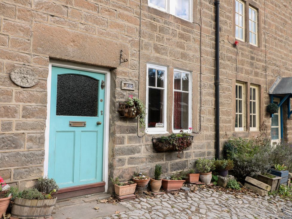 A front door with windows and plant pots at 40 Water Lane Matlock