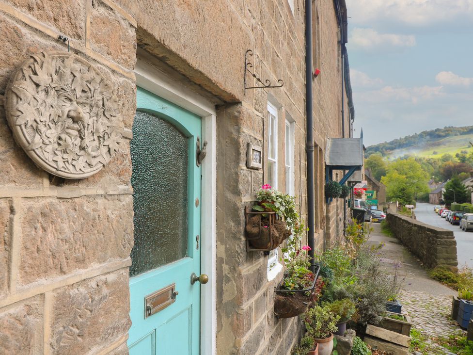 An entrance with a blue door and plants at 40 Water Lane Matlock