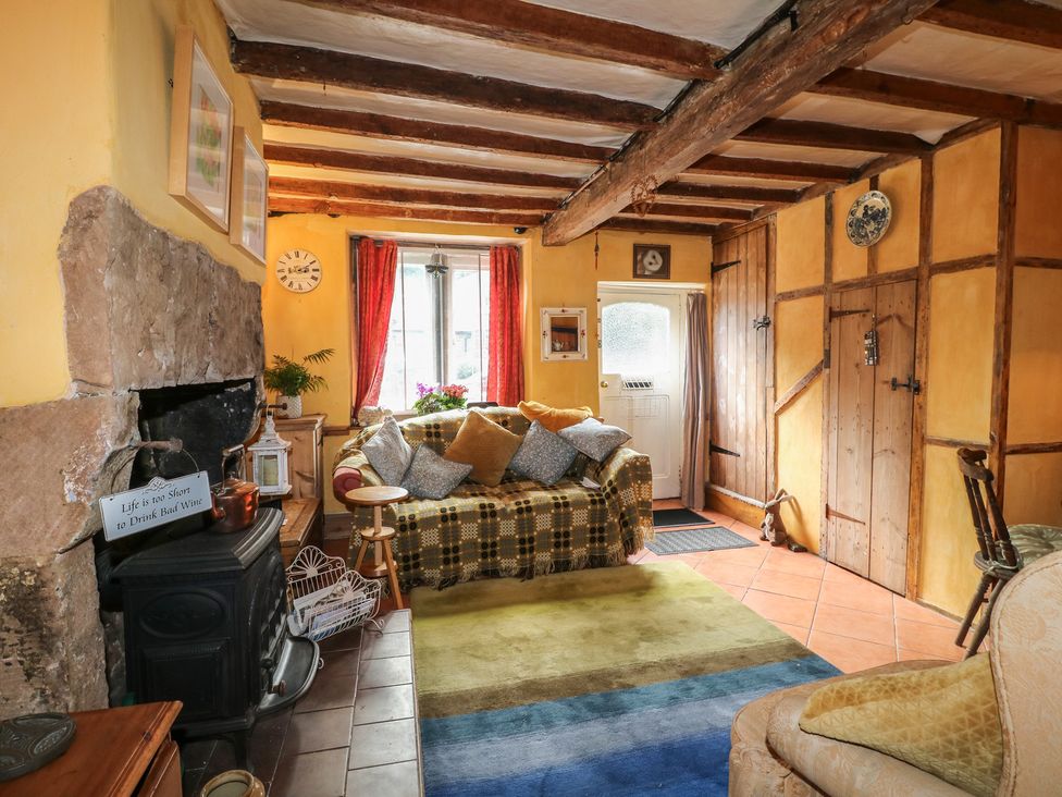 A living room with a sofa and fireplace at 40 Water Lane, Matlock