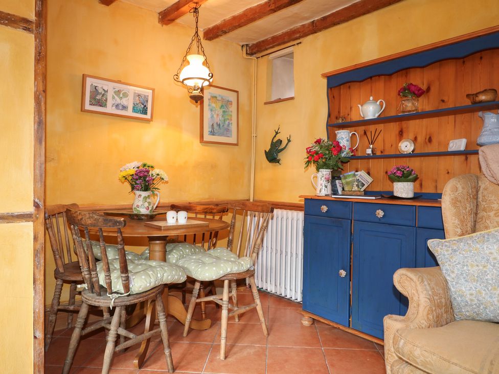 A dining area with a table and chairs at 40 Water Lane Matlock
