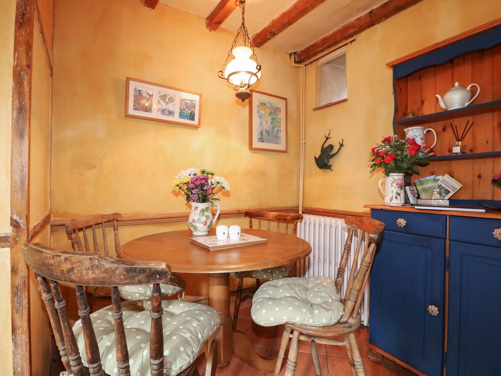 A dining room with a table and chairs at 40 Water Lane in Matlock