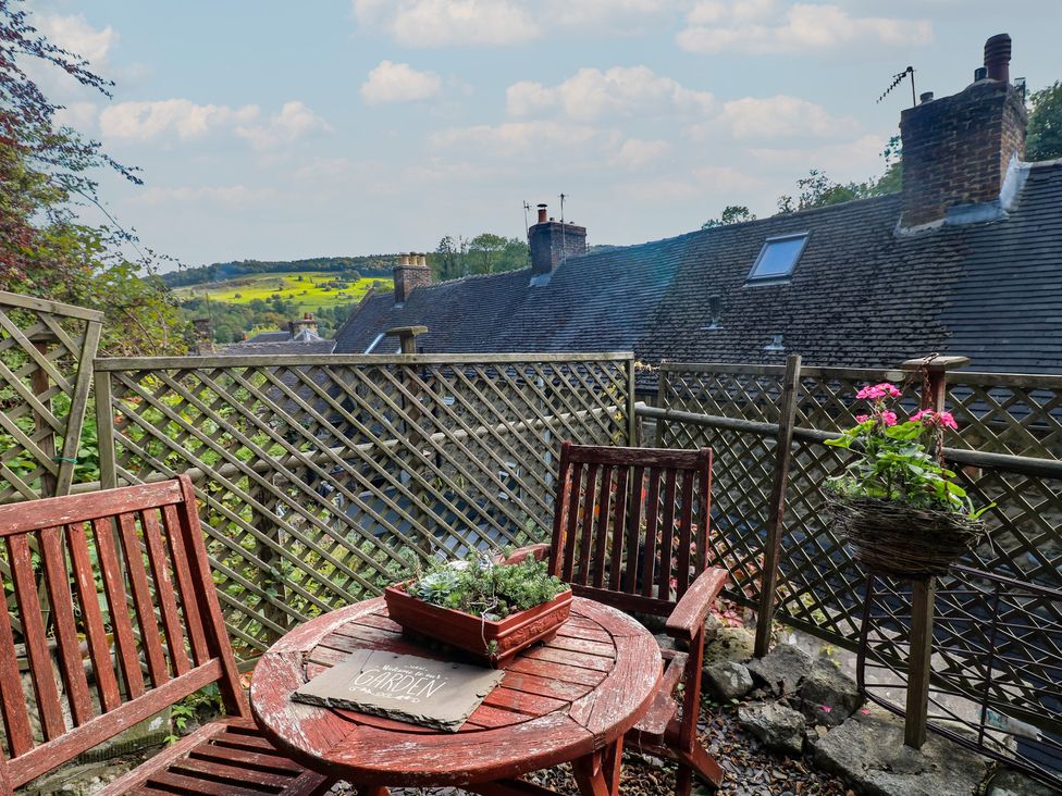 A terrace with a table and chairs at 40 Water Lane Matlock