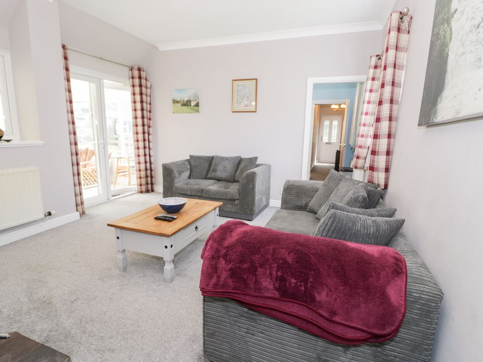 A living room with sofa and coffee table at Dyffryn Bach Glan-yr-afon near Corwen
