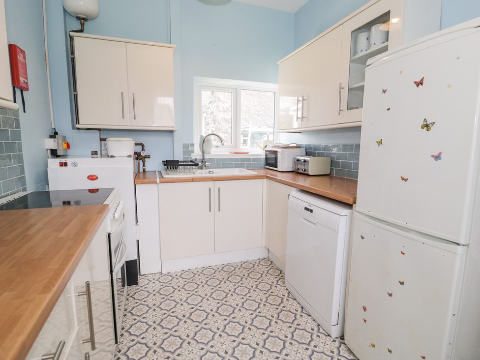 A kitchen with appliances and storage at Dyffryn Bach in Glan-yr-afon near Corwen