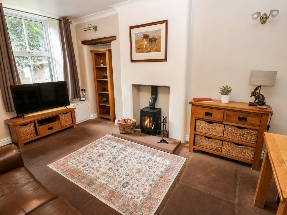 A living room with a television and fireplace at 27 Bongate Appleby-In-Westmorland