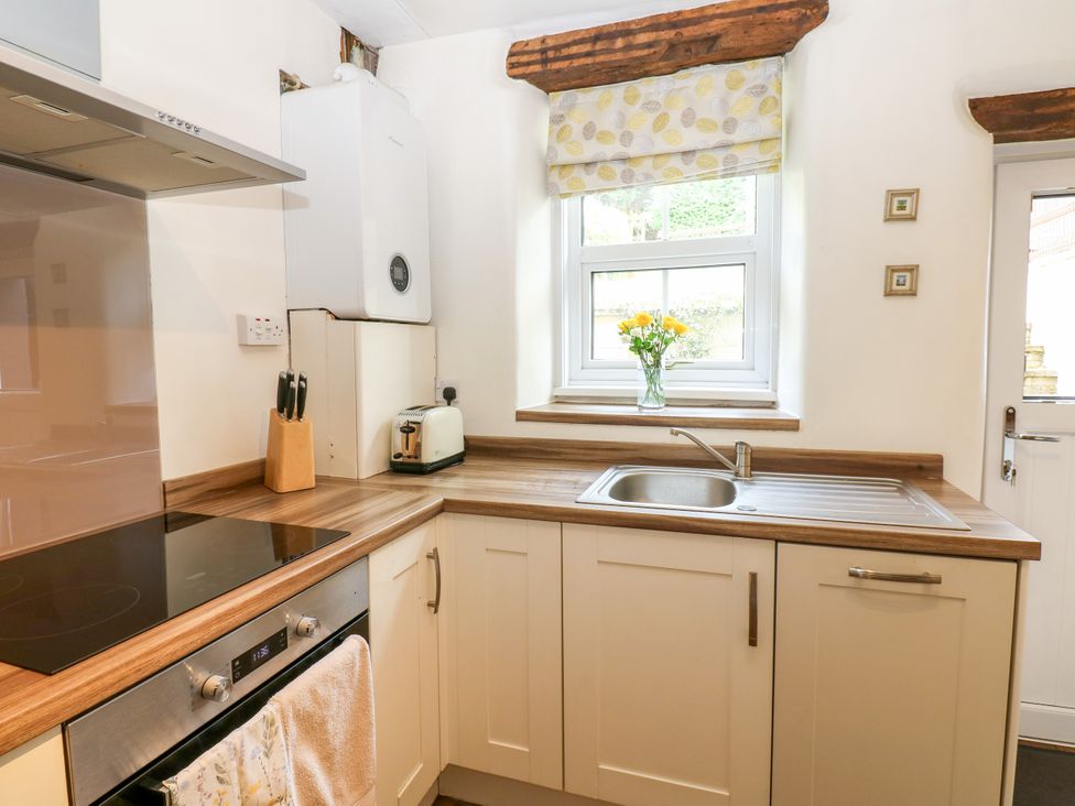 A kitchen with a sink and stove at 27 Bongate in Appleby-In-Westmorland