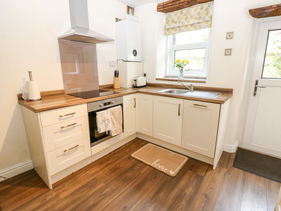 A kitchen with a sink and oven at 27 Bongate, Appleby-In-Westmorland
