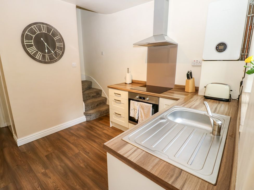 A kitchen with a sink and oven at 27 Bongate Appleby-In-Westmorland