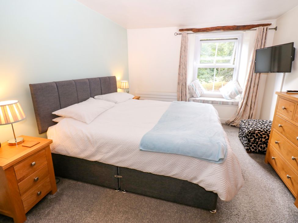 A bedroom with a bed and a television at 27 Bongate in Appleby-In-Westmorland