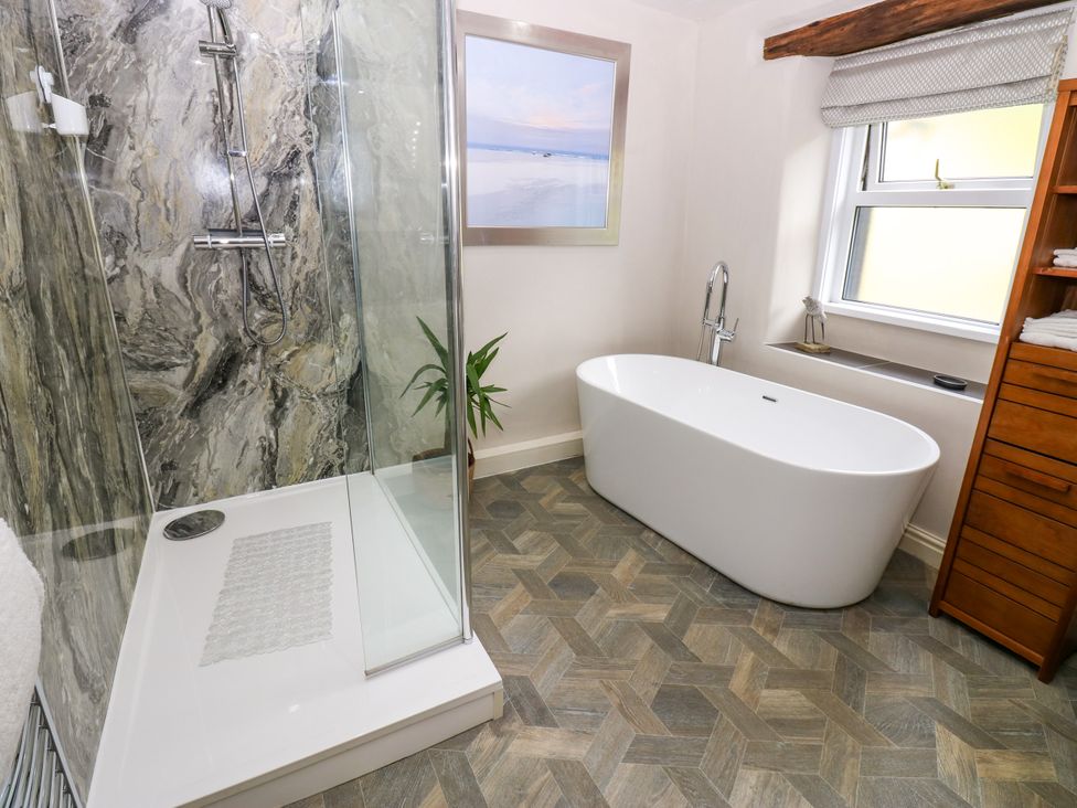 A bathroom with a shower and bathtub at 27 Bongate, Appleby-In-Westmorland