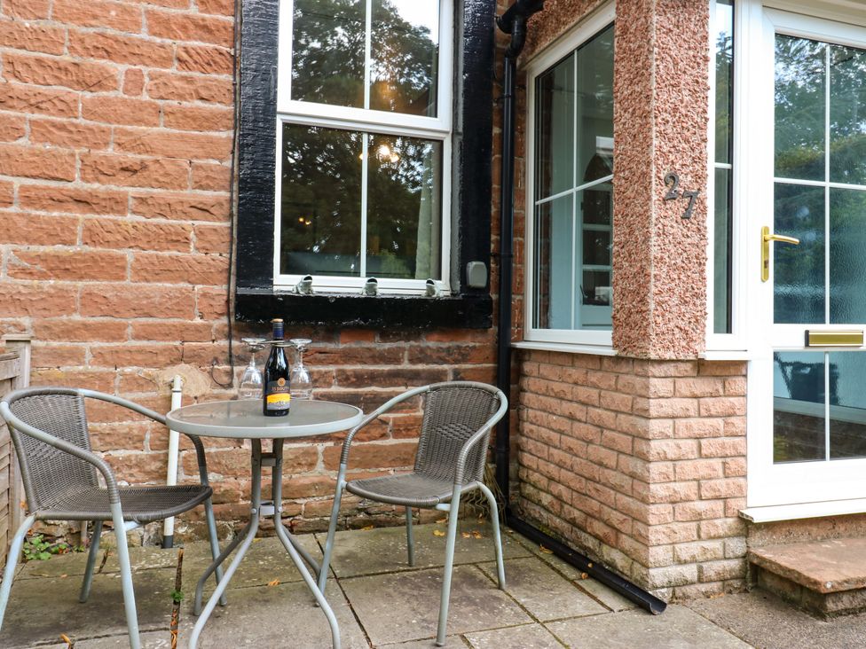 A table with chairs and a bottle on it at 27 Bongate in Appleby-In-Westmorland