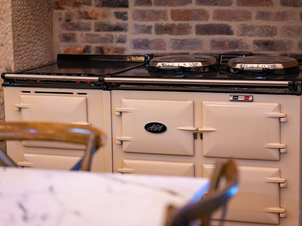 A stove with ovens in a kitchen at Wren Place Hall Worsbrough
