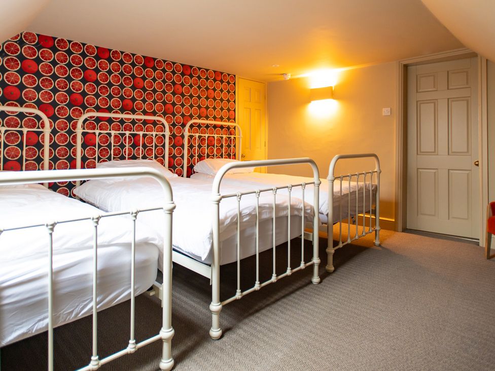 A bedroom with three beds at Wren Place Hall in Worsbrough