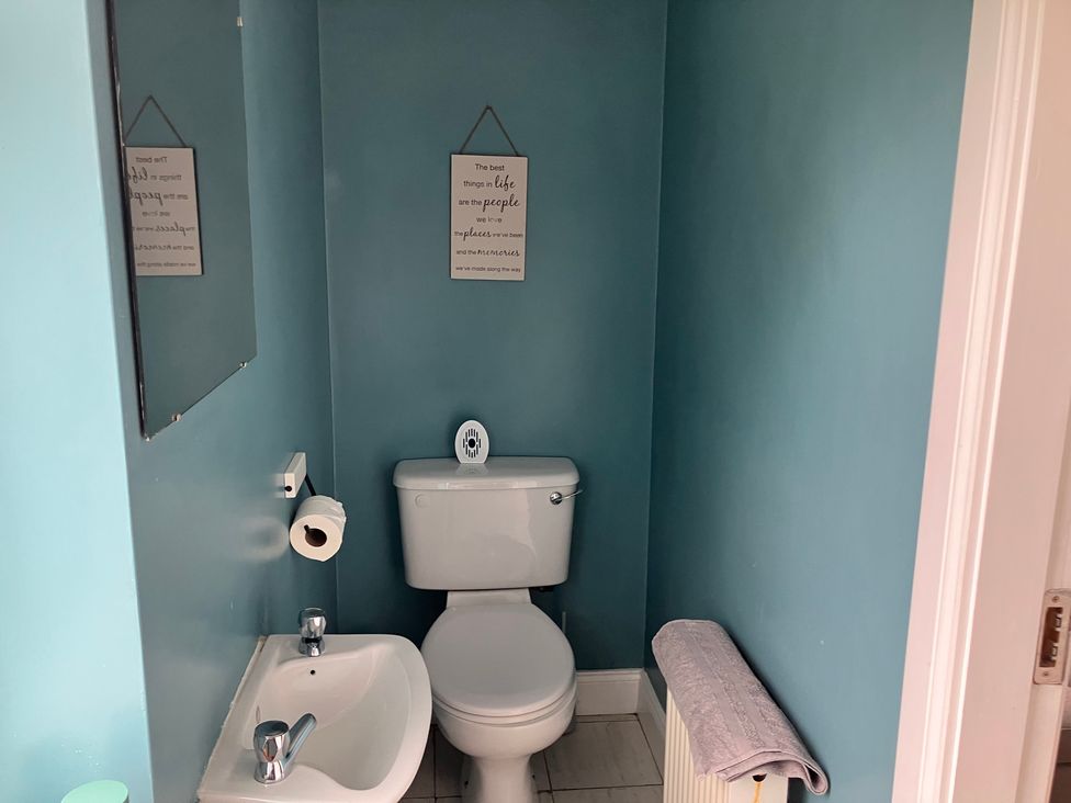 A bathroom with a sink and toilet at Silver Birch House Beaufort Killarney, County Kerry