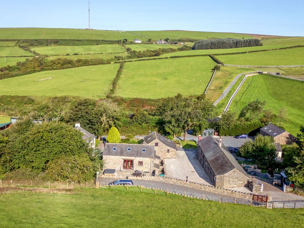 An overview of a property with buildings and fields at Ash Lodge Pennington near Ulverston