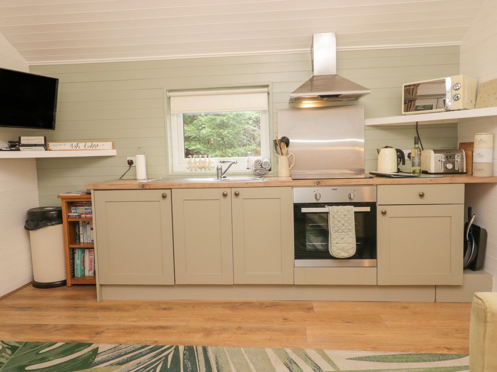 A kitchen with cabinets and appliances at Ash Lodge Pennington near Ulverston