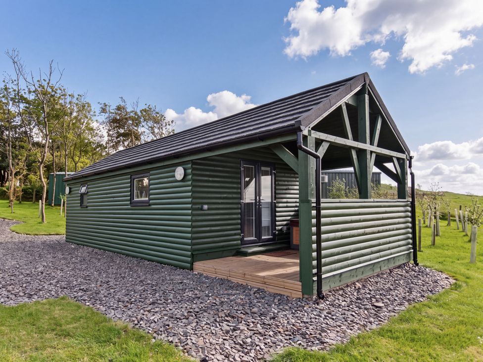 A house exterior with a deck at Ash Lodge in Pennington near Ulverston