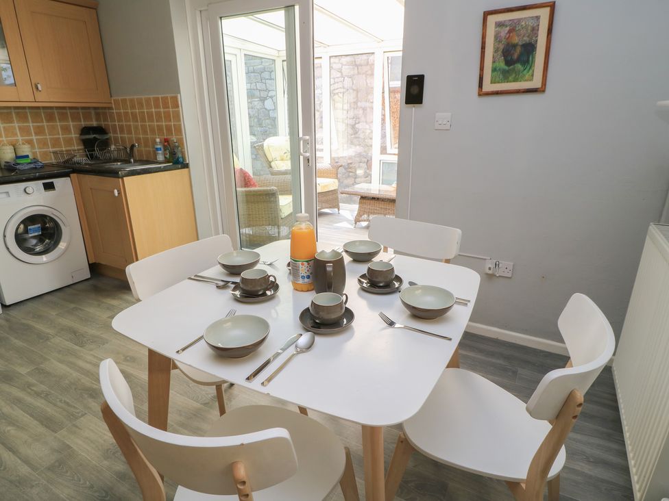 A dining room with a table set for six at Lamora in Cheddar