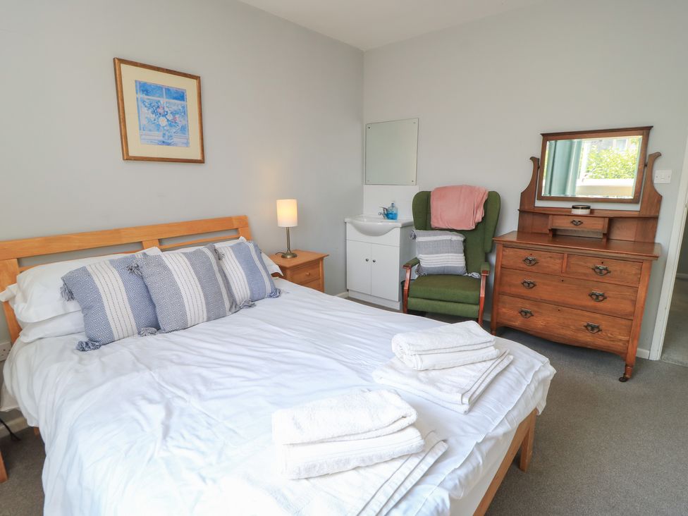 A bedroom with a bed and a dresser at Lamora in Cheddar