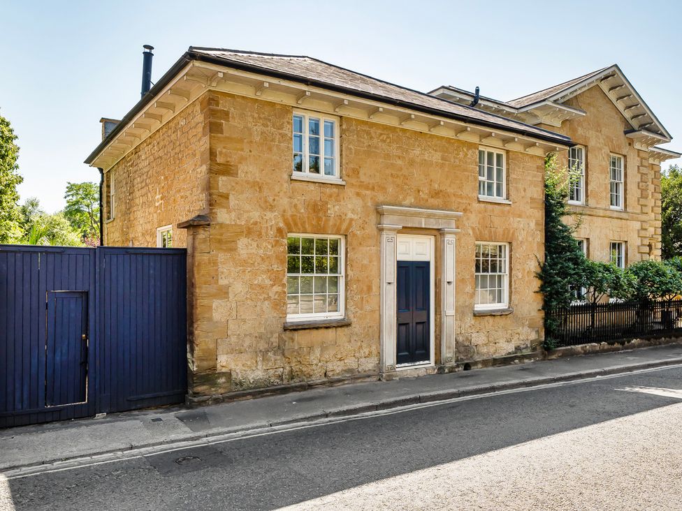 A house with a gate and stone wall at East Wing in Crewkerne